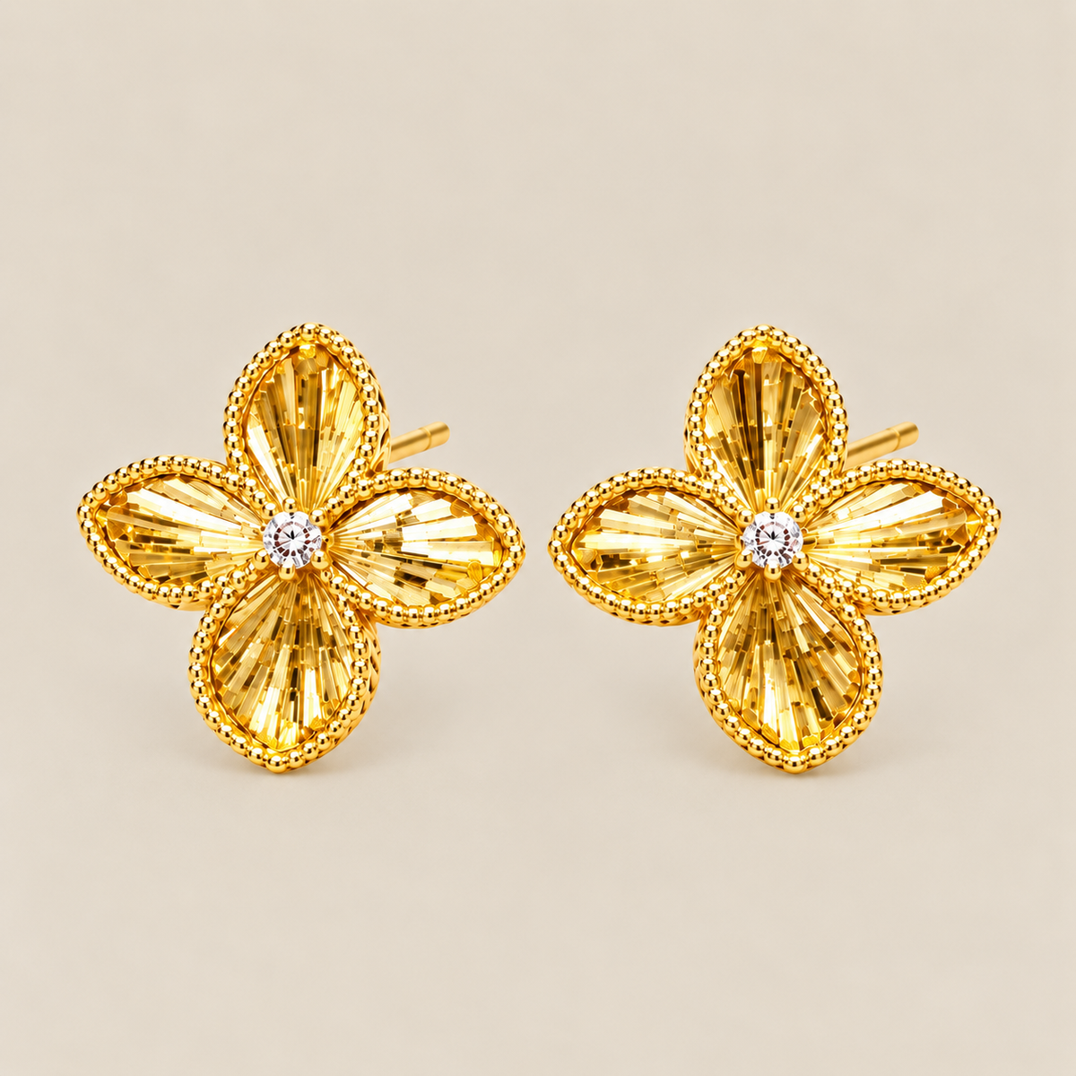 Gold-tone four-petal flower stud earrings