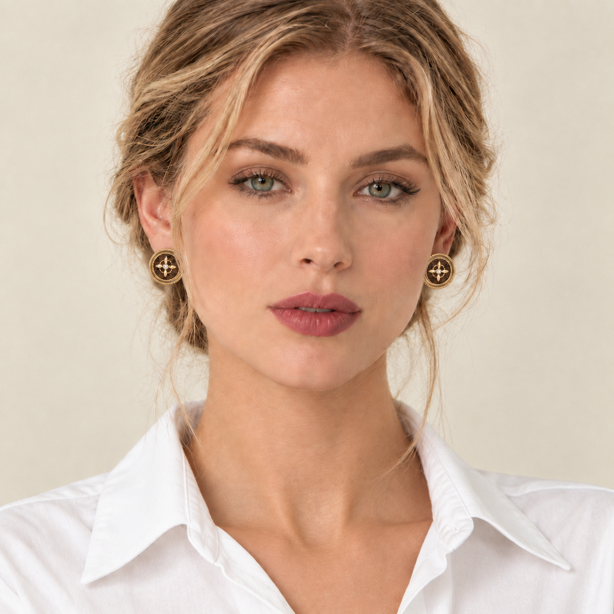 Model wearing brown round statement stud earrings