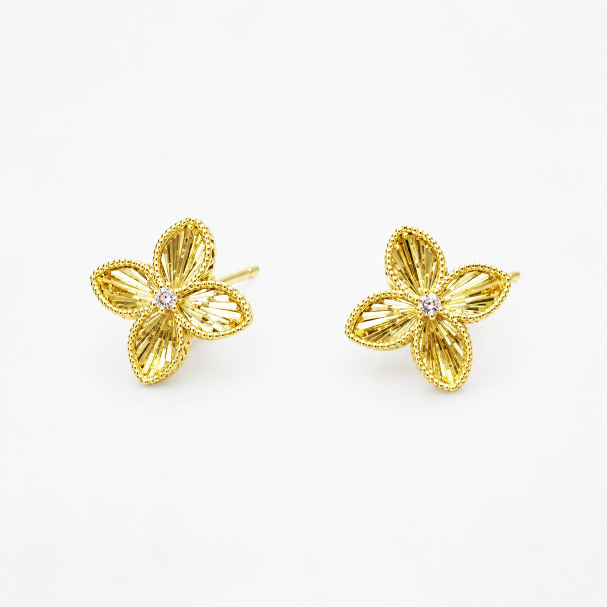 Gold-tone four-petal flower stud earrings