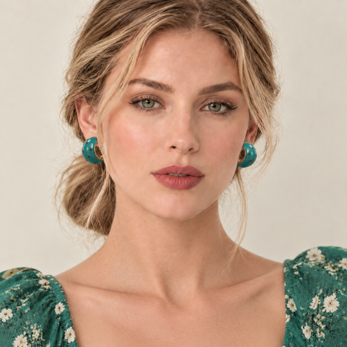 Model wearing green polka dot chunky hoop earrings
