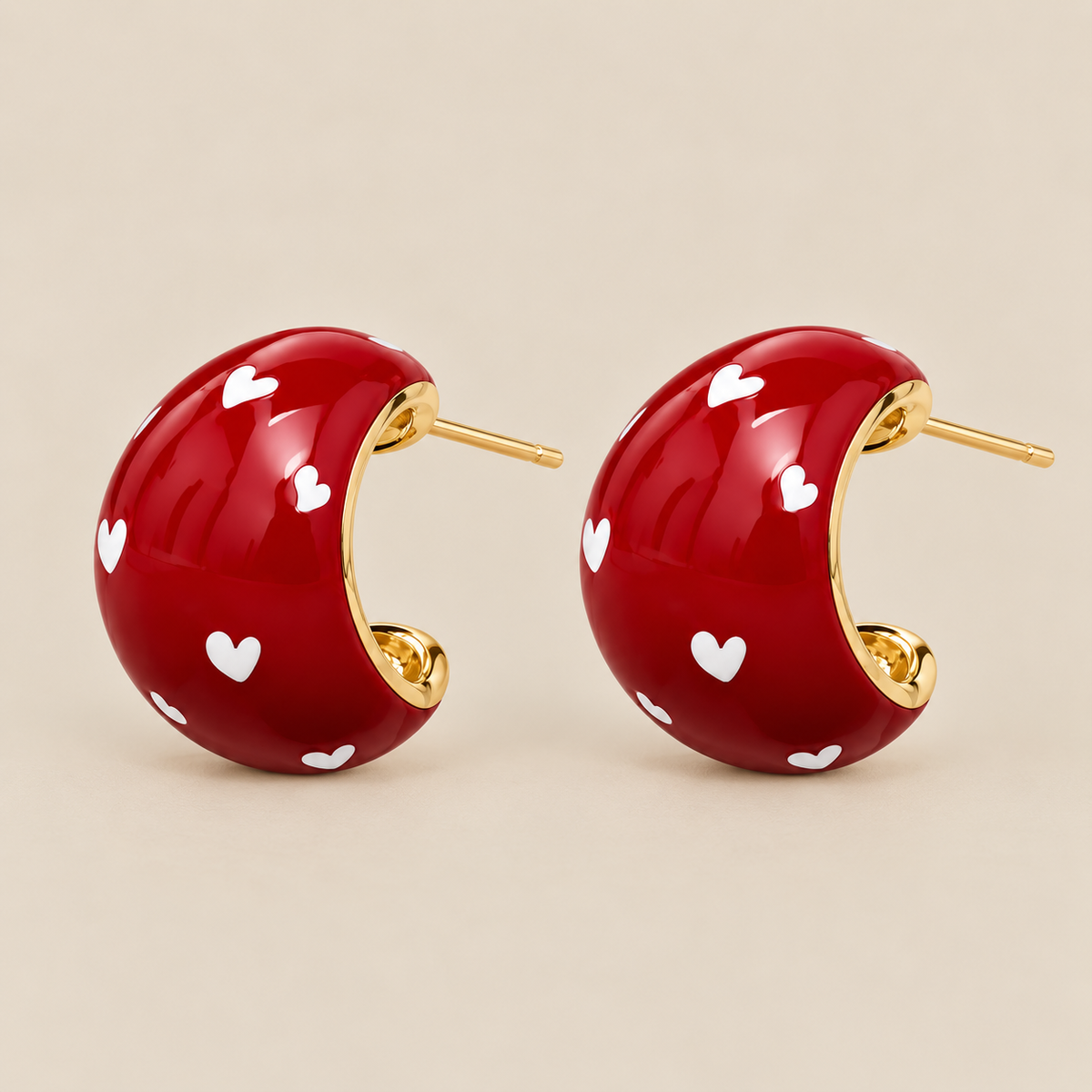 Red heart chunky stud earrings with gold-tone details