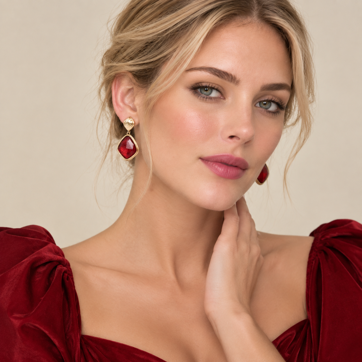 Model wearing red imitation gemstone drop earrings