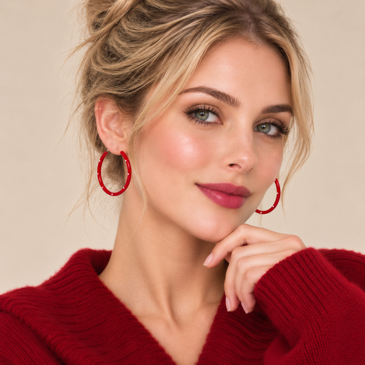 Model wearing red polka dot hoop earrings