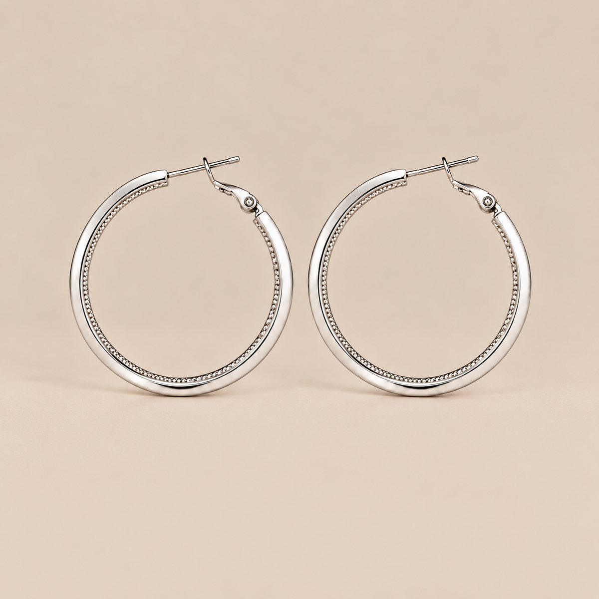 Silver textured hoop earrings front view